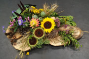 rouwwerk op hout schijven met zonnebloemen